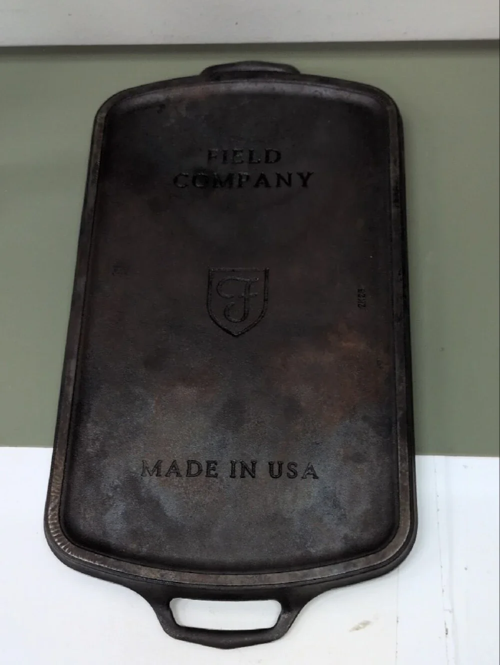 Field Company Long Cast Iron Griddle features a vintage-style .